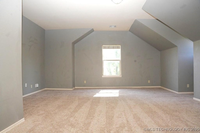 717 W 39th St, Sand Springs, OK 74063 - additional living space featuring carpet flooring, vaulted ceiling, and baseboards