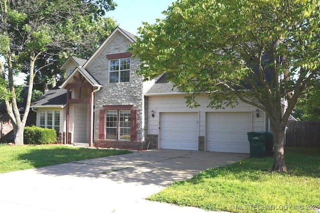 717 W 39th St, Sand Springs, OK 74063 - view of front of property with driveway, brick siding, a garage, and stone siding