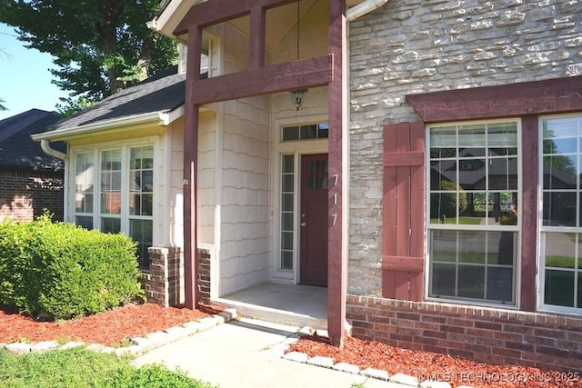 717 W 39th St, Sand Springs, OK 74063 - view of exterior entry featuring stone siding