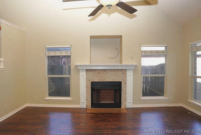717 W 39th St, Sand Springs, OK 74063 - unfurnished living room with wood-type flooring, a fireplace with flush hearth, lofted ceiling, ceiling fan, and baseboards