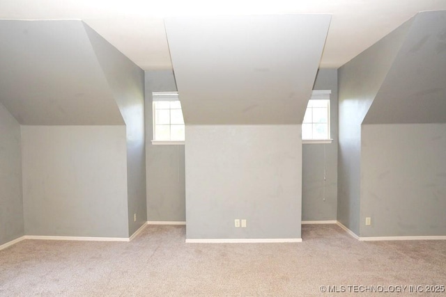717 W 39th St, Sand Springs, OK 74063 - additional living space featuring plenty of natural light, lofted ceiling, and carpet