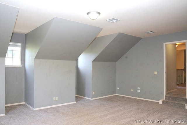 717 W 39th St, Sand Springs, OK 74063 - bonus room with carpet flooring, lofted ceiling, and baseboards