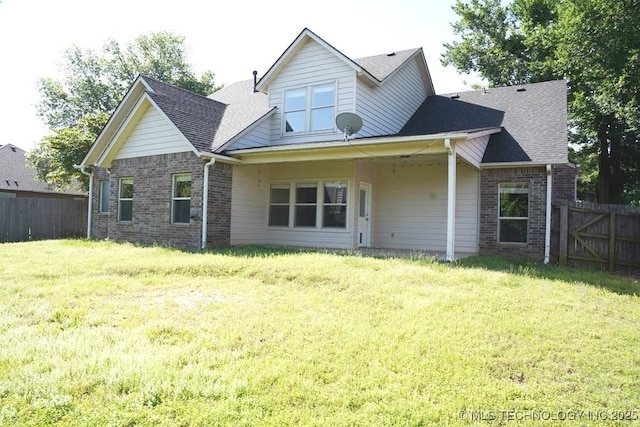717 W 39th St, Sand Springs, OK 74063 - rear view of house with brick siding and a shingled roof