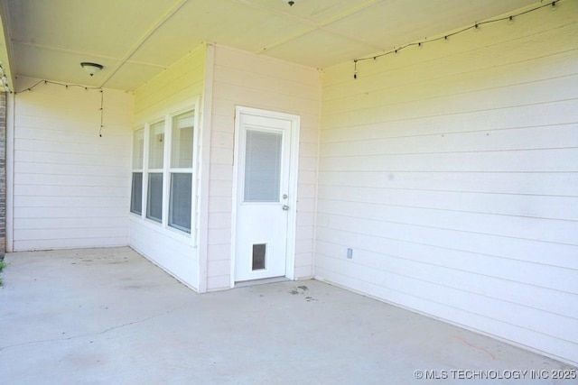 717 W 39th St, Sand Springs, OK 74063 - doorway to property with a patio area