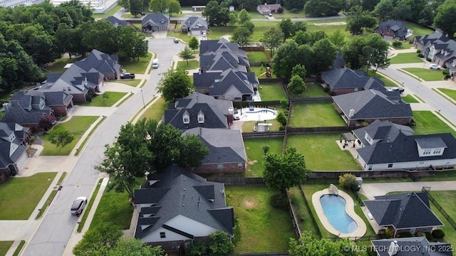 717 W 39th St, Sand Springs, OK 74063 - aerial view of property and surrounding area featuring nearby suburban area and a pool