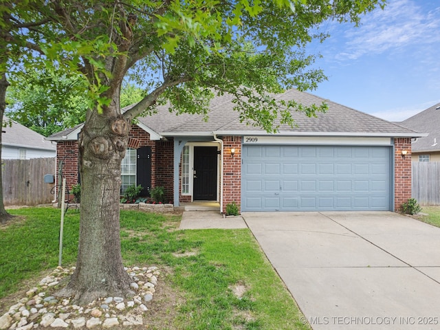 view of front of home featuring brick siding, a shingled roof, driveway, and a garage