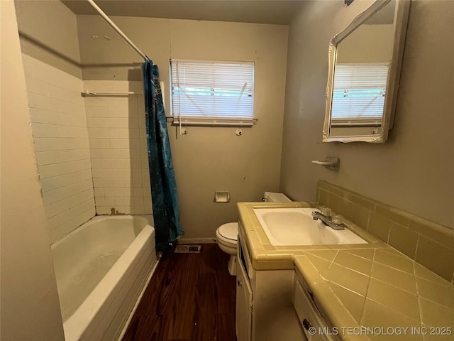 628 S 105th E Pl, Tulsa, OK 74128 - bathroom with wood finished floors, toilet, vanity, and shower / bath combo