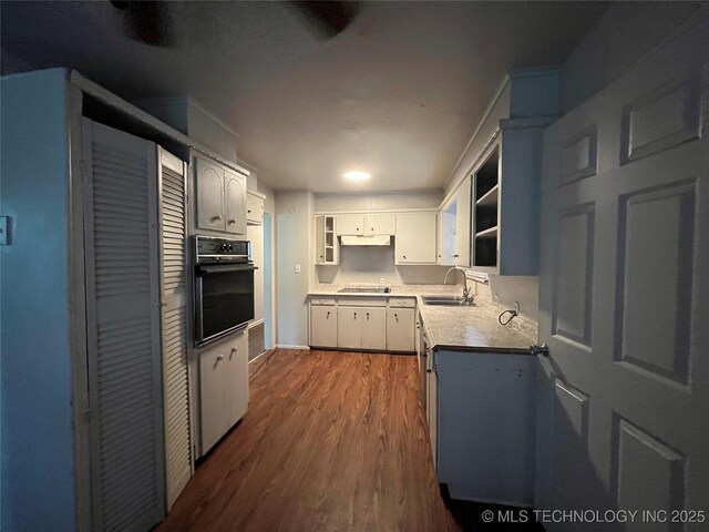 628 S 105th E Pl, Tulsa, OK 74128 - kitchen with black appliances, a sink, dark wood-type flooring, open shelves, and under cabinet range hood