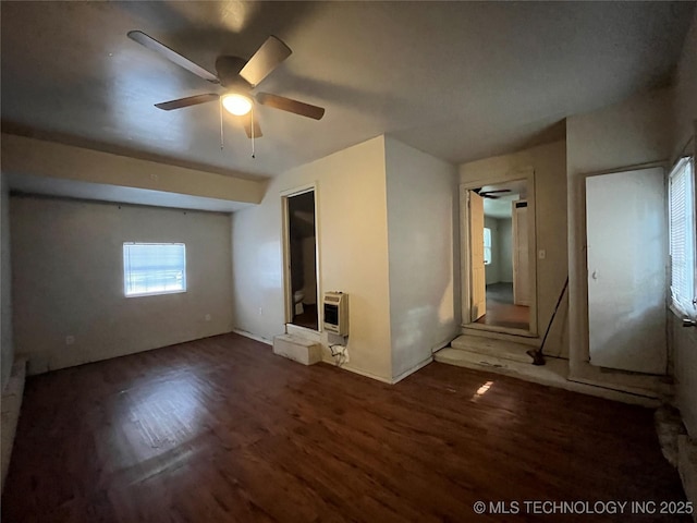 628 S 105th E Pl, Tulsa, OK 74128 - unfurnished living room with wood finished floors, ceiling fan, and heating unit
