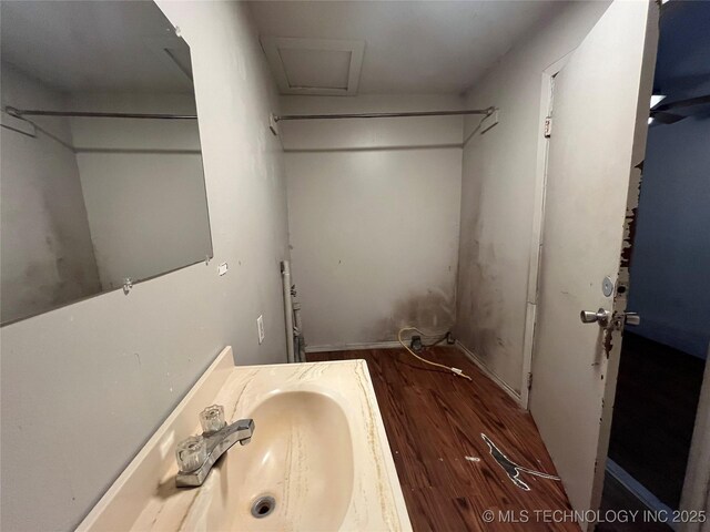 628 S 105th E Pl, Tulsa, OK 74128 - bathroom with wood finished floors and a sink