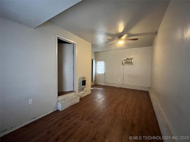 628 S 105th E Pl, Tulsa, OK 74128 - unfurnished living room with heating unit, a ceiling fan, wood finished floors, a wall unit AC, and baseboards