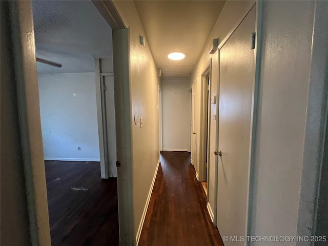 628 S 105th E Pl, Tulsa, OK 74128 - hallway with wood finished floors, baseboards, and attic access