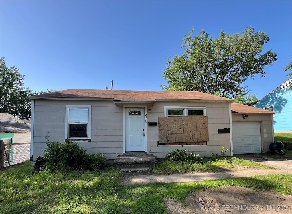 2320 W Easton Ct, Tulsa, OK 74127 - view of front of home with a garage and fence