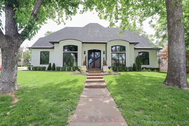 2503 S Birmingham Ave, Tulsa, OK 74114 - french country home featuring roof with shingles and a front lawn