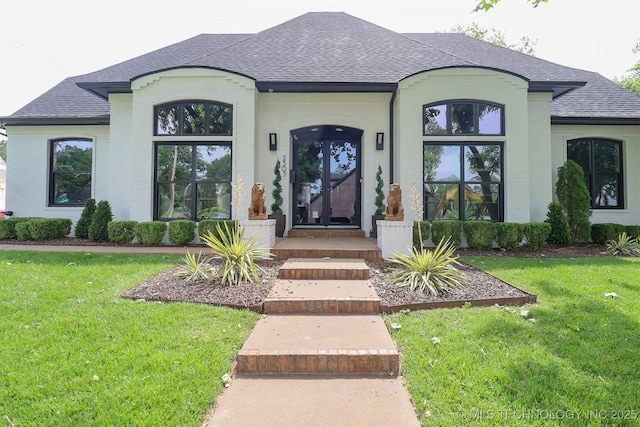 2503 S Birmingham Ave, Tulsa, OK 74114 - view of front of property featuring a shingled roof and brick siding