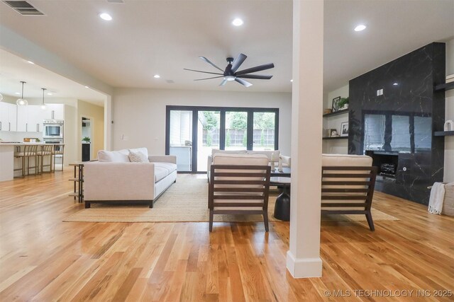 2503 S Birmingham Ave, Tulsa, OK 74114 - living area with ceiling fan, light wood finished floors, and recessed lighting