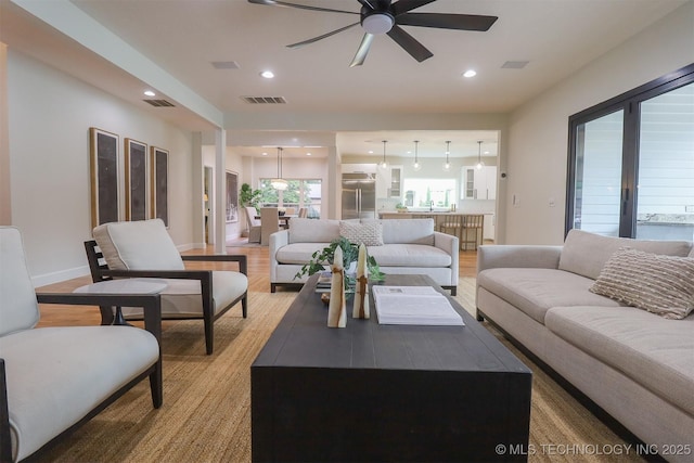 2503 S Birmingham Ave, Tulsa, OK 74114 - living room with a ceiling fan, recessed lighting, and light wood-type flooring