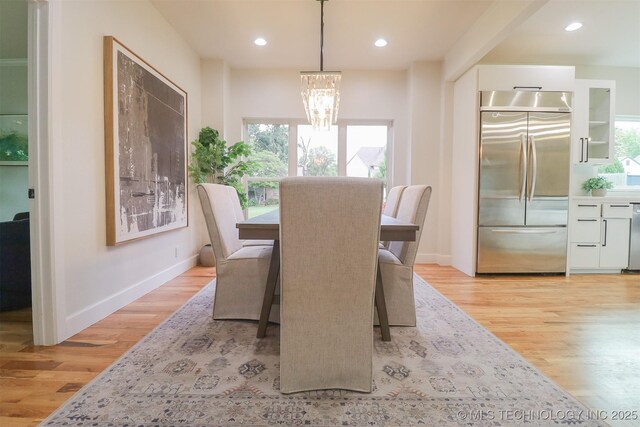 2503 S Birmingham Ave, Tulsa, OK 74114 - dining area featuring light wood finished floors, plenty of natural light, a chandelier, baseboards, and recessed lighting