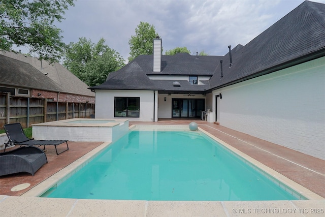2503 S Birmingham Ave, Tulsa, OK 74114 - view of swimming pool with a patio area and a pool with connected hot tub