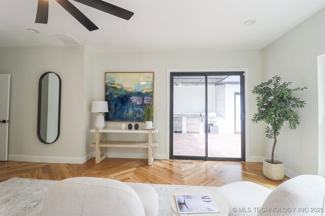 2503 S Birmingham Ave, Tulsa, OK 74114 - living area with a ceiling fan, baseboards, and wood finished floors