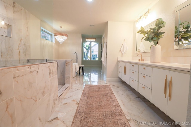 2503 S Birmingham Ave, Tulsa, OK 74114 - bathroom with marble tiled flooring, double vanity, a chandelier, a walk in shower, and recessed lighting