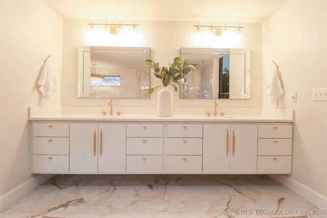 2503 S Birmingham Ave, Tulsa, OK 74114 - full bath featuring marble look tiles, double vanity, and baseboards
