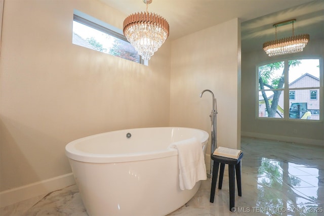 2503 S Birmingham Ave, Tulsa, OK 74114 - full bathroom featuring a chandelier, marble finish floors, and healthy amount of natural light