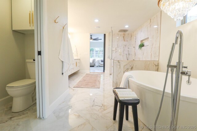 2503 S Birmingham Ave, Tulsa, OK 74114 - ensuite bathroom with marble finish flooring, a ceiling fan, a freestanding tub, recessed lighting, and toilet