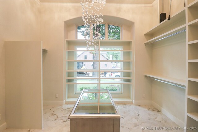 2503 S Birmingham Ave, Tulsa, OK 74114 - spacious closet with a chandelier and light marble finish floors