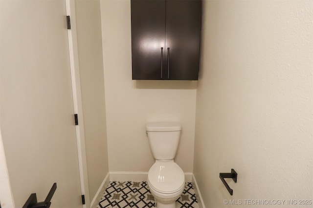 2503 S Birmingham Ave, Tulsa, OK 74114 - bathroom with baseboards and toilet