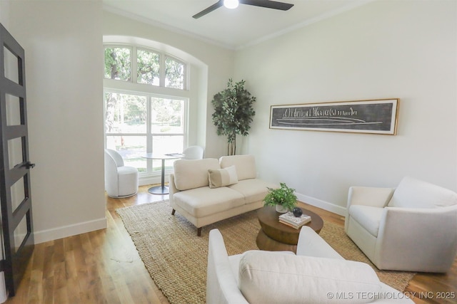 2503 S Birmingham Ave, Tulsa, OK 74114 - living room featuring plenty of natural light, wood finished floors, a ceiling fan, crown molding, and baseboards