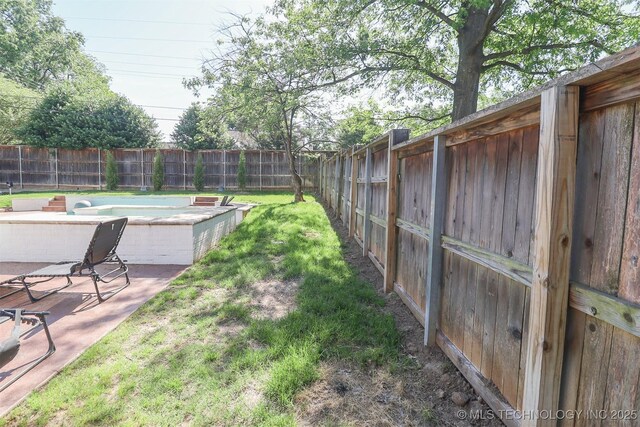 2503 S Birmingham Ave, Tulsa, OK 74114 - view of yard with a jacuzzi