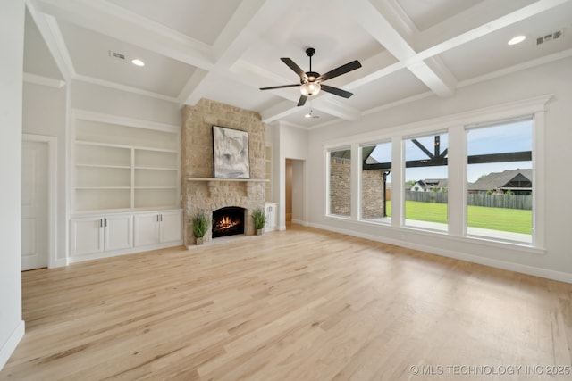 unfurnished living room featuring coffered ceiling, wood finished floors, a ceiling fan, baseboards, and beam ceiling
