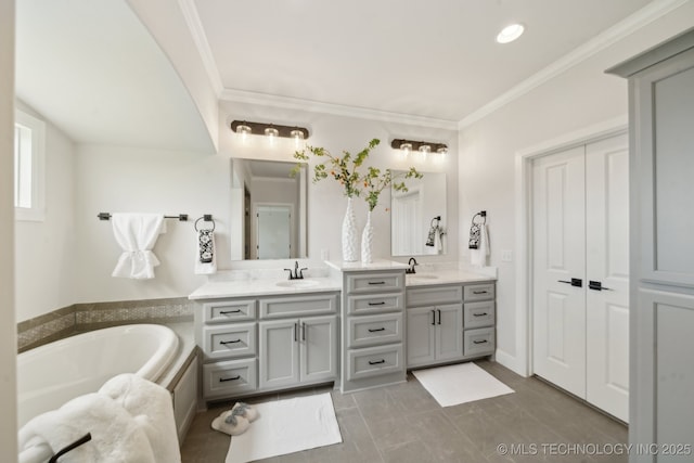 full bathroom featuring double vanity, a bath, ornamental molding, and recessed lighting