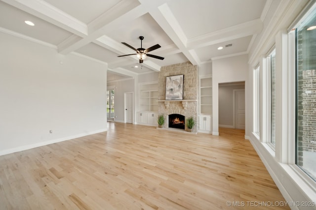 unfurnished living room with healthy amount of natural light, light wood-style flooring, beam ceiling, recessed lighting, and ceiling fan
