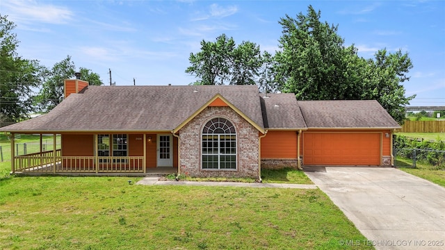 view of front of house featuring an attached garage, driveway, covered porch, a chimney, and a shingled roof