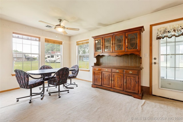 office area featuring ceiling fan, light colored carpet, and baseboards