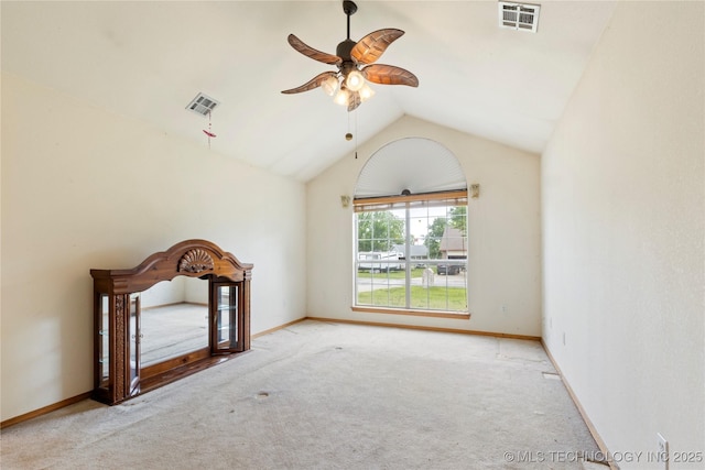 unfurnished living room with vaulted ceiling, carpet floors, ceiling fan, and baseboards