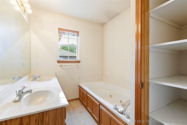 full bath with a whirlpool tub and double vanity