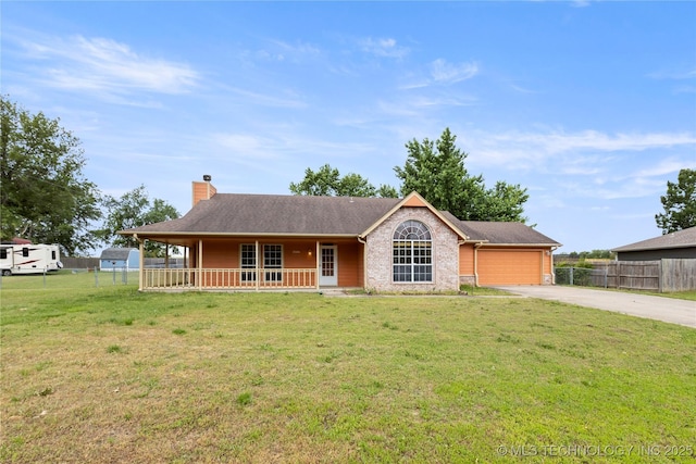 ranch-style home featuring a chimney, driveway, an attached garage, and covered porch