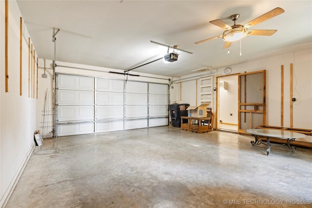 garage with a garage door opener, baseboards, and a ceiling fan