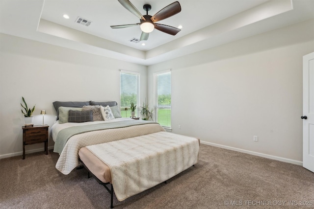 9429 Bryan Rd, Shawnee, OK 74855 - bedroom featuring a tray ceiling, carpet floors, baseboards, a ceiling fan, and recessed lighting