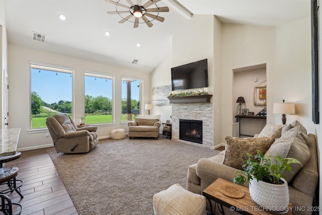 9429 Bryan Rd, Shawnee, OK 74855 - living area with a fireplace, beam ceiling, wood finished floors, high vaulted ceiling, and baseboards