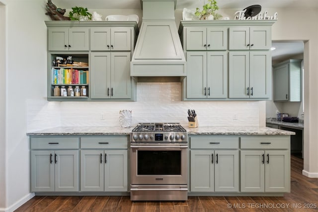 9429 Bryan Rd, Shawnee, OK 74855 - kitchen with stainless steel gas stove, premium range hood, tasteful backsplash, and light stone countertops