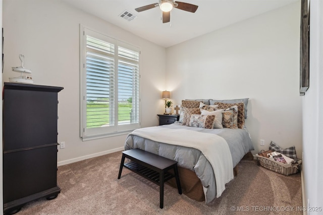 9429 Bryan Rd, Shawnee, OK 74855 - bedroom with multiple windows, carpet flooring, baseboards, and a ceiling fan