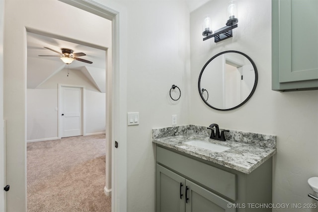 9429 Bryan Rd, Shawnee, OK 74855 - bathroom with vanity, a ceiling fan, toilet, lofted ceiling, and baseboards