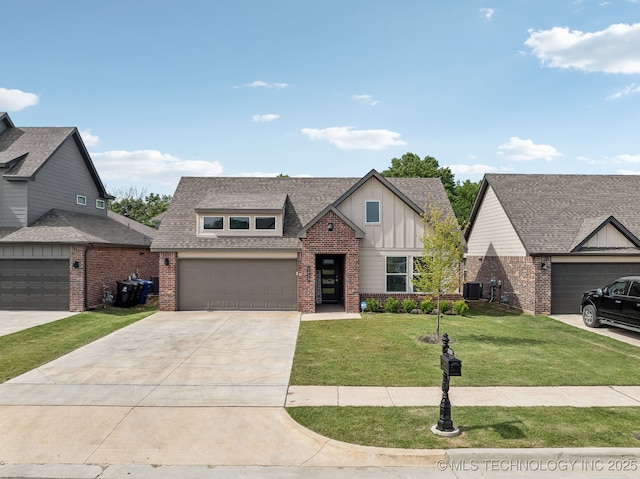 view of front of property with board and batten siding, brick siding, a front lawn, and driveway