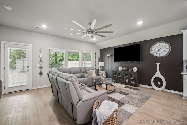 living room with ceiling fan, light wood finished floors, baseboards, recessed lighting, and lofted ceiling