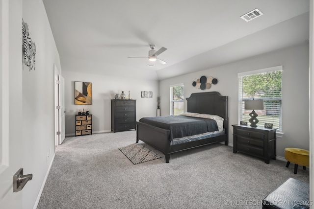 carpeted bedroom with baseboards, lofted ceiling, and a ceiling fan