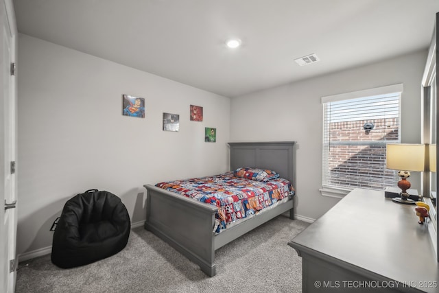 bedroom with baseboards and carpet floors